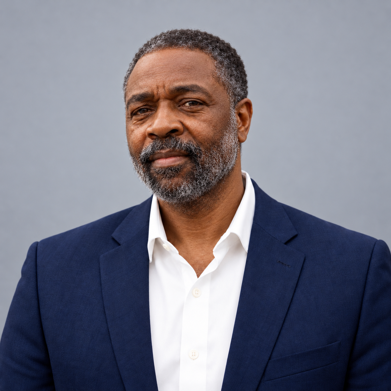 Jason Tartt, Sr. in navy business attire